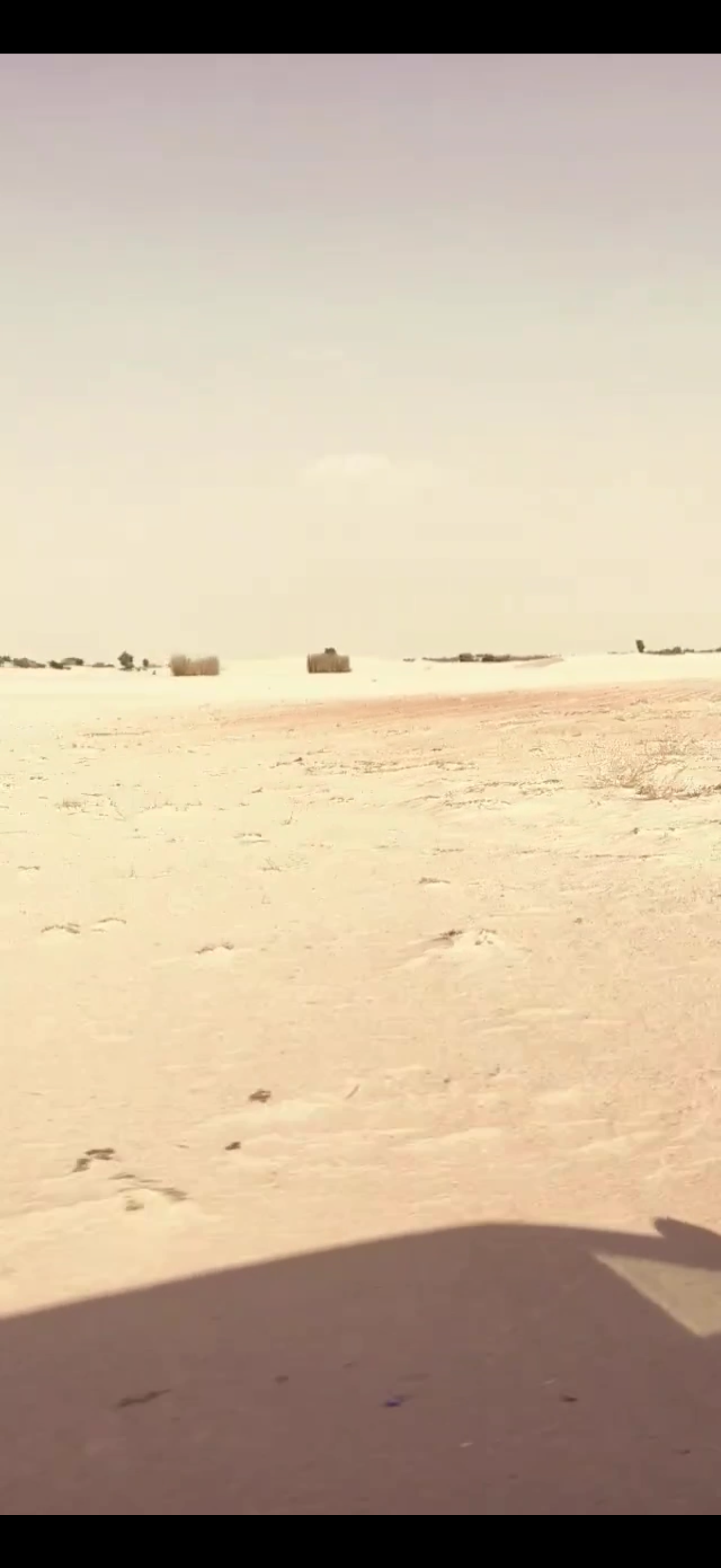 Desert landscape seen from a moving vehicle
