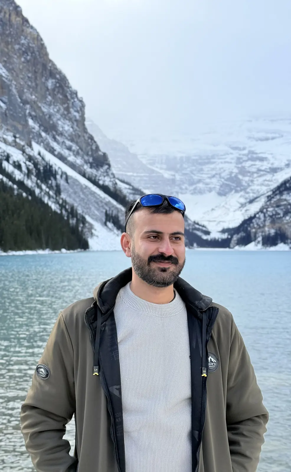 Salman Haider standing in front of Lake Louise in winter