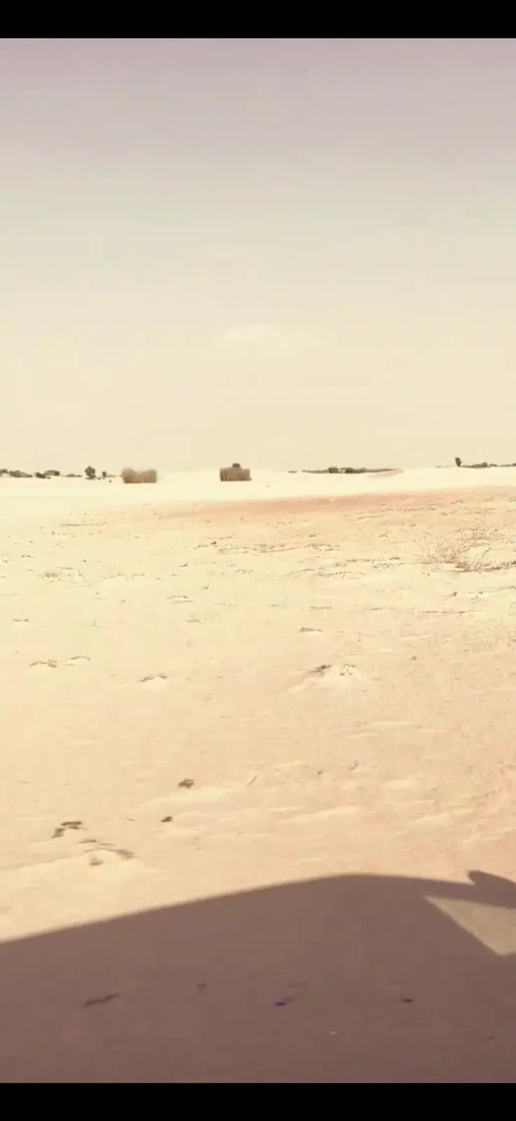Desert landscape seen from a moving vehicle